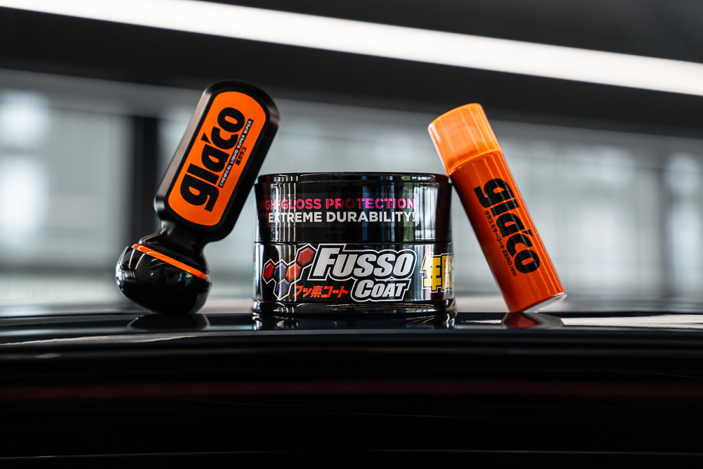 Photo of the Protection Time set, a car care set from the Japanese car care manufacturer Soft99, consisting of Fusso Coat wax, Ultra Glaco glass coating, and Glaco Mirror Coat Zero ultrahydrophobic coating for mirrors and cameras.